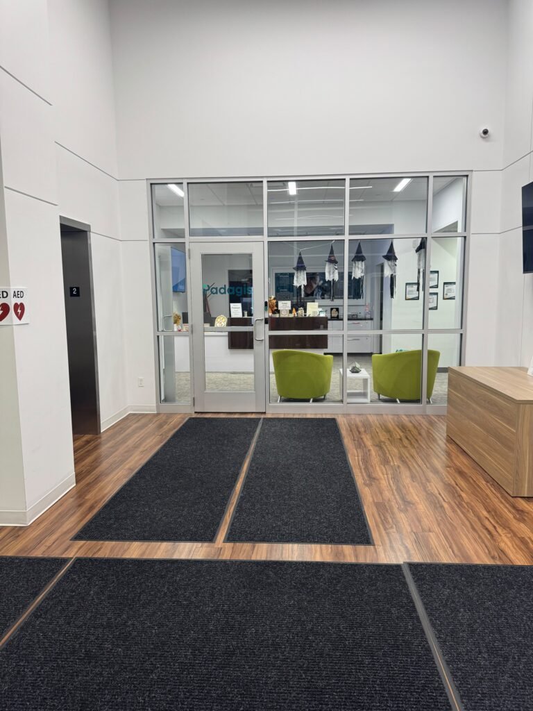 Clean lobby entrance with floor mats and lounge chairs – Champion Facility Solutions