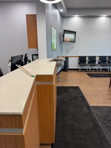 Clean reception counter and waiting area with entrance mat – Champion Facility Solutions