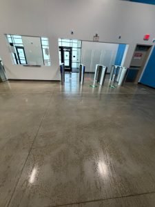 Polished concrete floor in a commercial facility after cleaning – Champion Facility Solutions